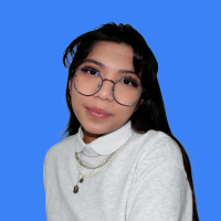 A UX Designer with glasses and curled bangs